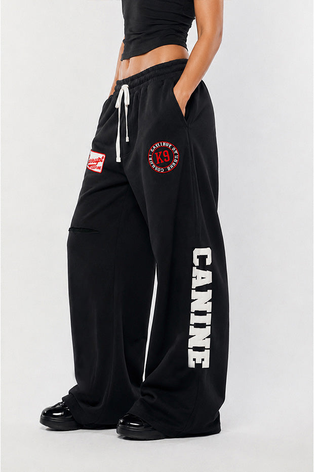 CORRUPTK9 HEAVYWEIGHT WIDE LEG SWEATPANTS WITH EMBROIDERED LOGO PATCHES & STATEMENT LEG GRAPHICS