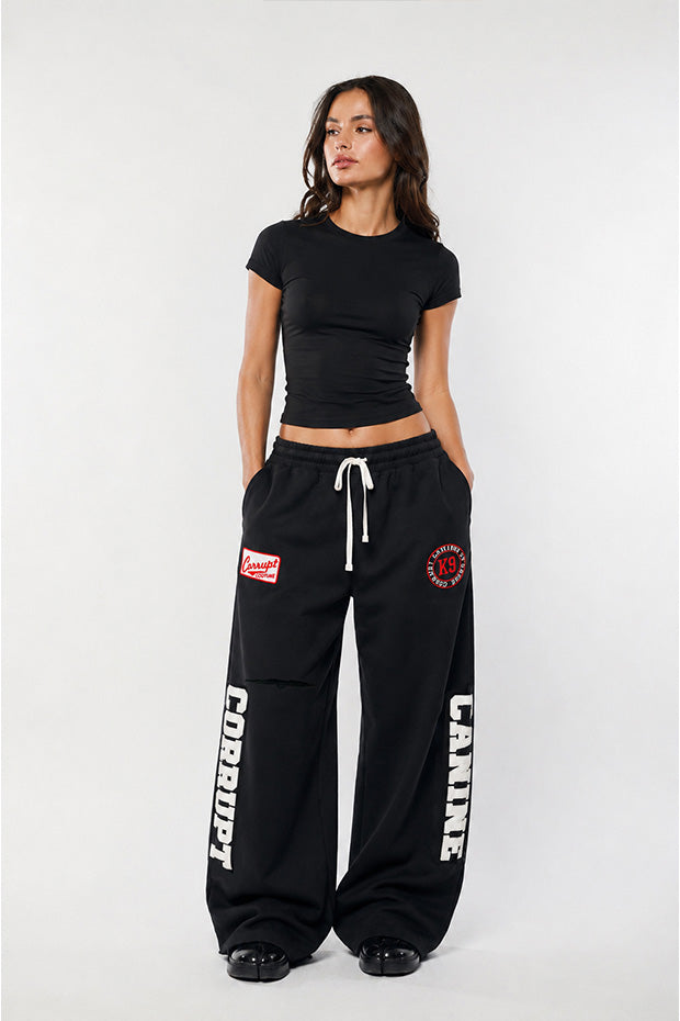 CORRUPTK9 HEAVYWEIGHT WIDE LEG SWEATPANTS WITH EMBROIDERED LOGO PATCHES & STATEMENT LEG GRAPHICS