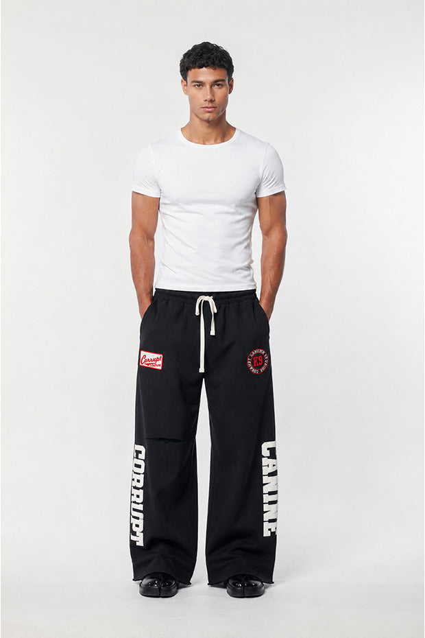 CORRUPTK9 HEAVYWEIGHT WIDE LEG SWEATPANTS WITH EMBROIDERED LOGO PATCHES & STATEMENT LEG GRAPHICS