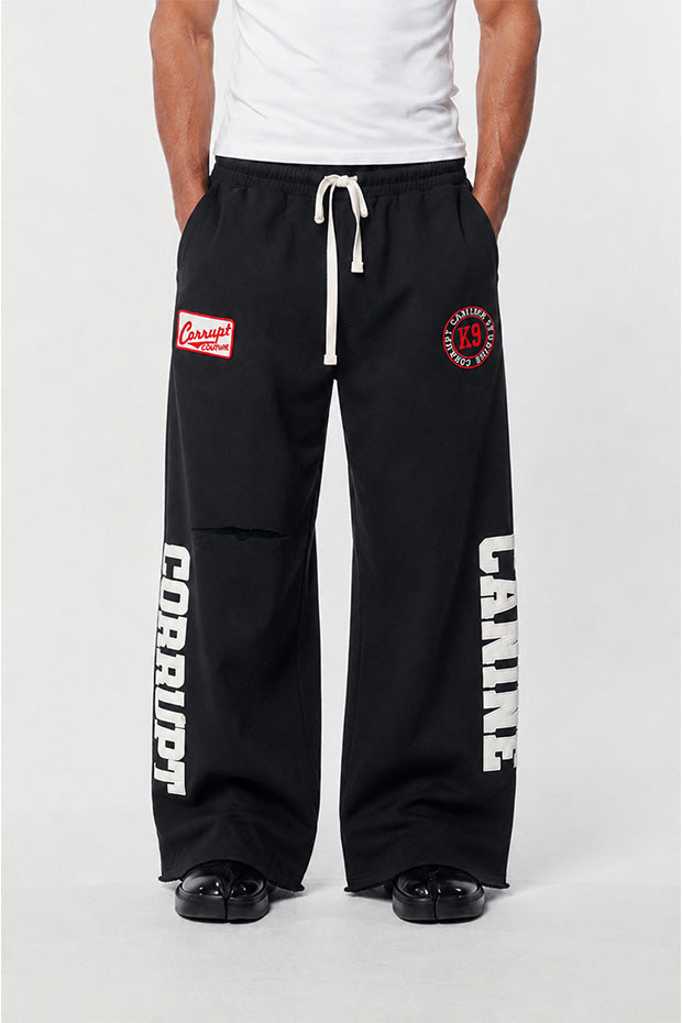 CORRUPTK9 HEAVYWEIGHT WIDE LEG SWEATPANTS WITH EMBROIDERED LOGO PATCHES & STATEMENT LEG GRAPHICS