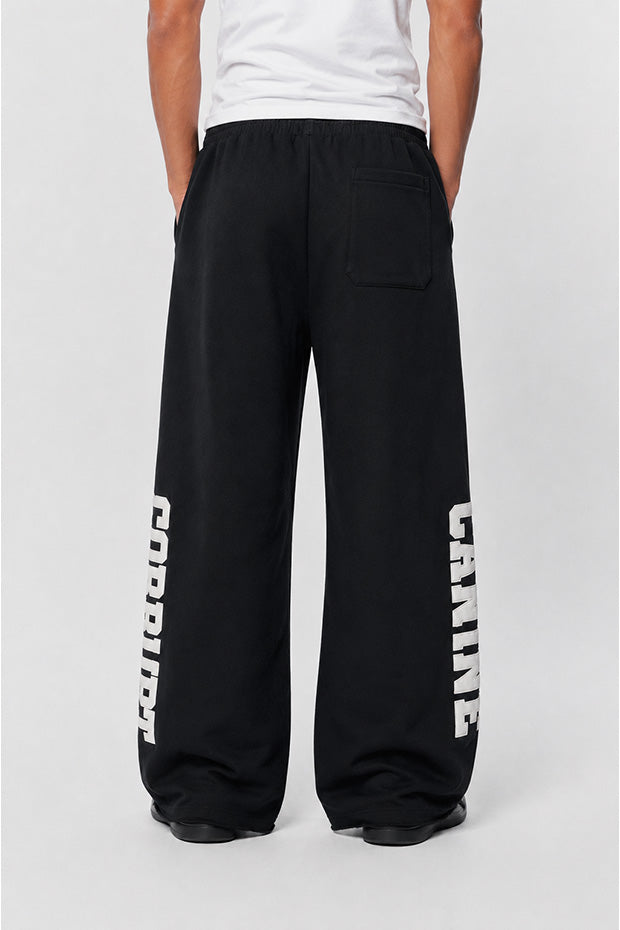 CORRUPTK9 HEAVYWEIGHT WIDE LEG SWEATPANTS WITH EMBROIDERED LOGO PATCHES & STATEMENT LEG GRAPHICS